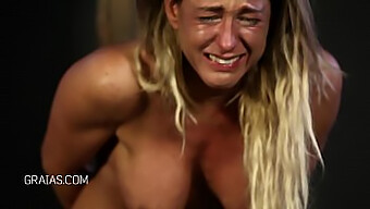 Busty Blonde Fitness Trainer Gets Caned And Cries Out In Pain